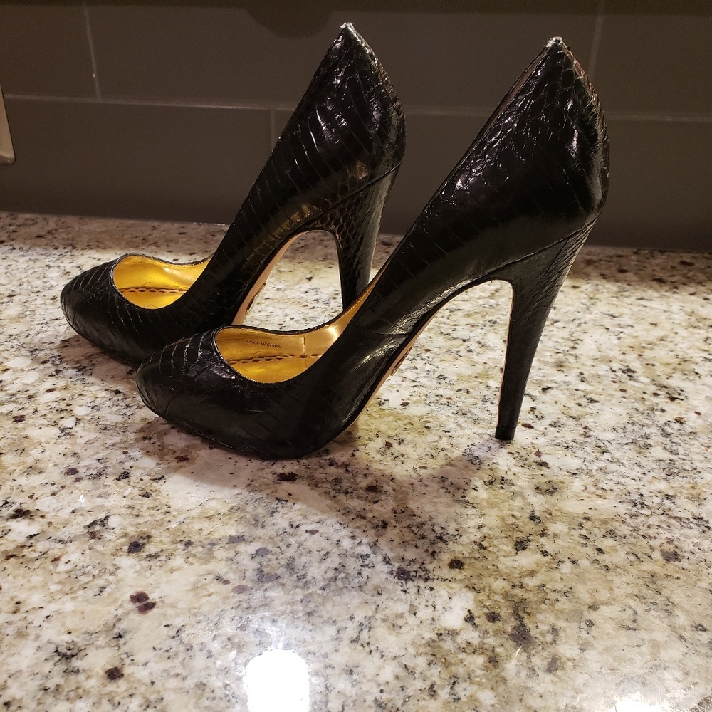 Black leather Bebe pumps